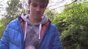Czech lad with nice blond hair drills in a park
