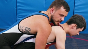 Varsity Grip: Dakota Lovell beside Joel Someone wrestling